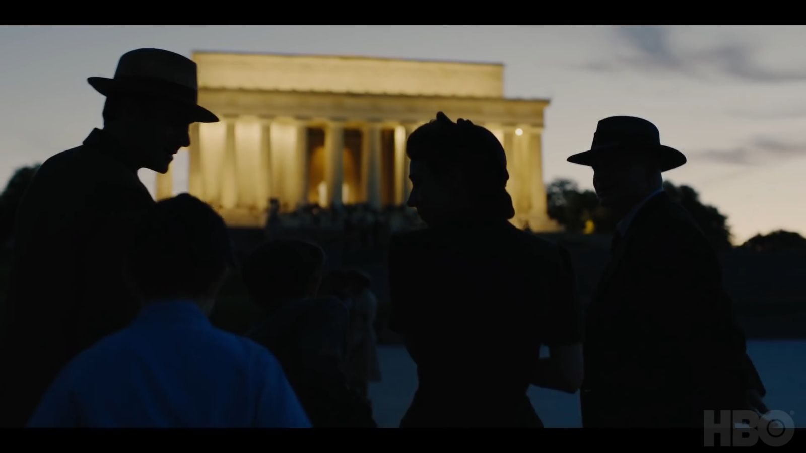 a group of people standing in front of a building