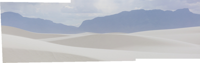 a desert landscape with mountains in the background