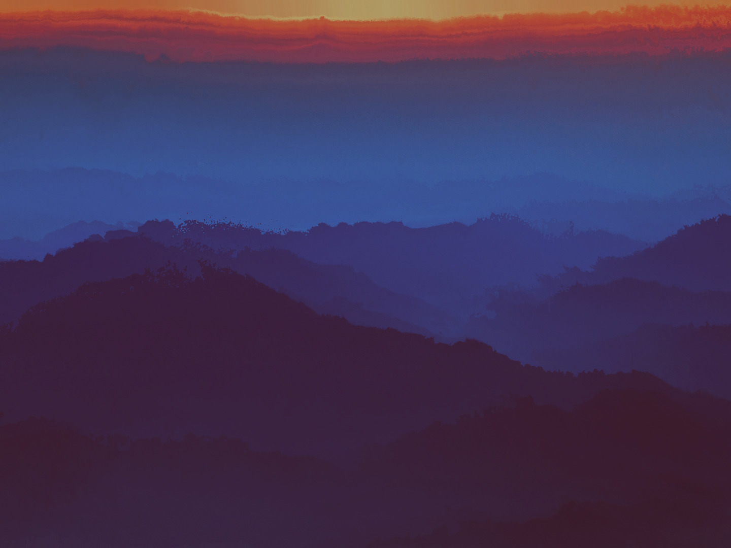 a view of a mountain range at sunset