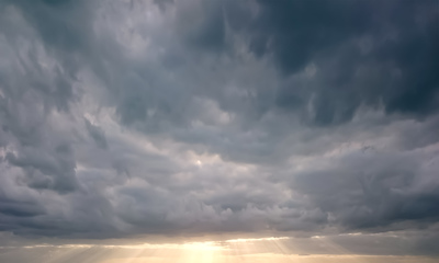 a large body of water under a cloudy sky