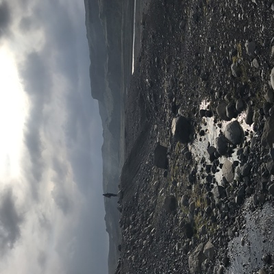 a view of the ocean from a rocky beach