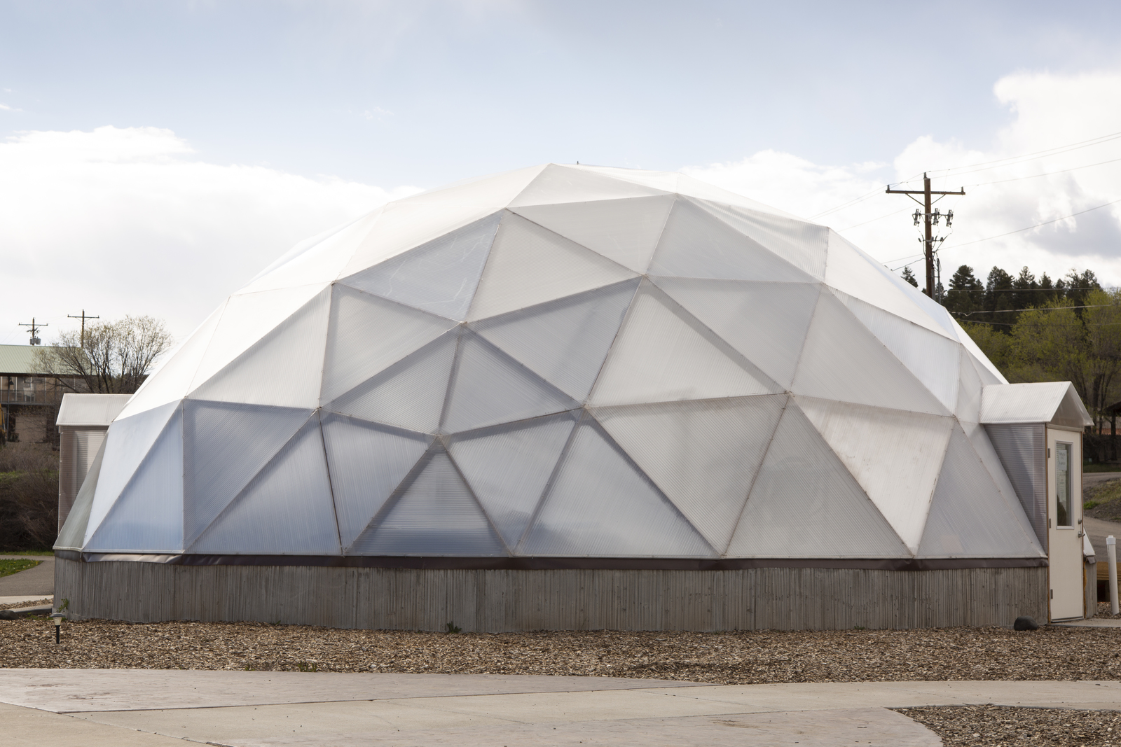 a large white dome sitting on the side of a road