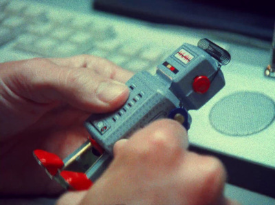 a person holding a lighter near a keyboard