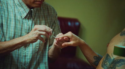 a man holding a woman's hand in a room