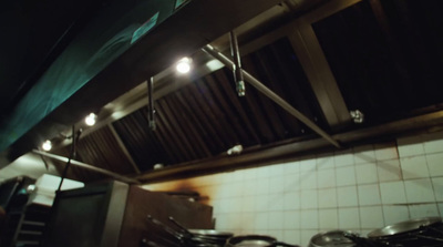 a stove top oven sitting inside of a kitchen