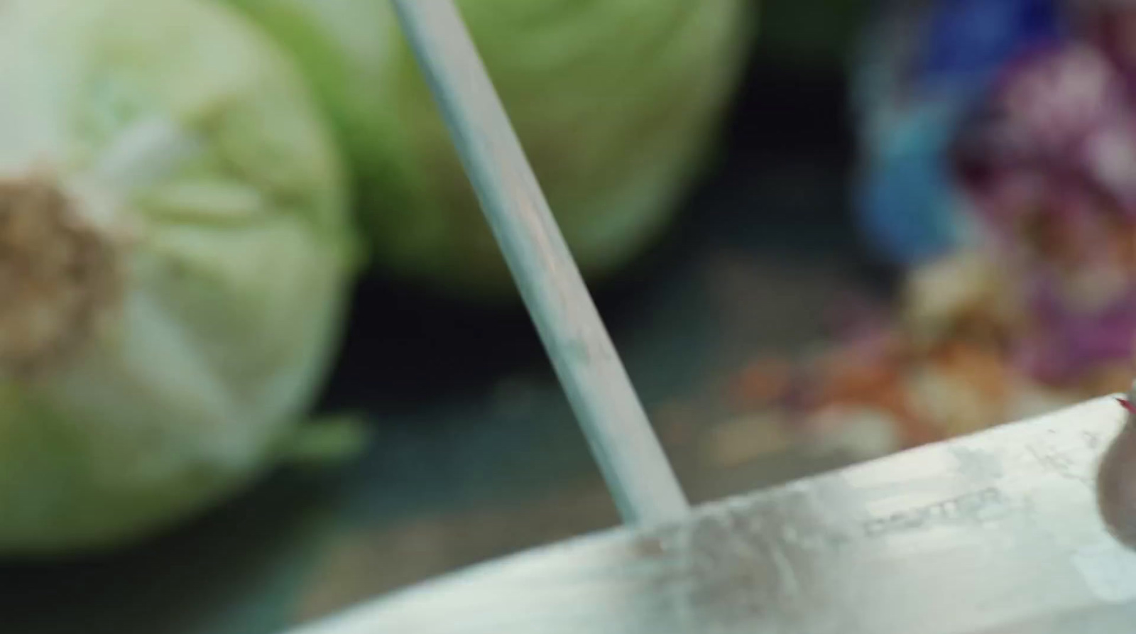 a close up of a knife on a cutting board