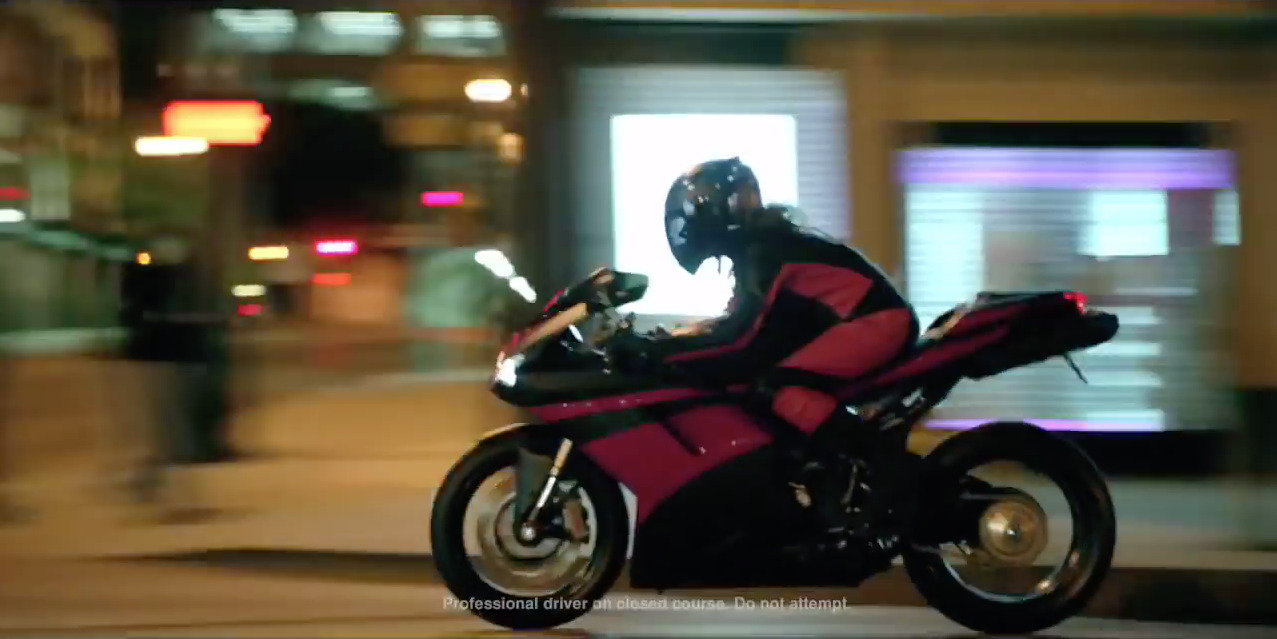 a person riding a motorcycle on a city street