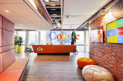 a man standing in front of a google office