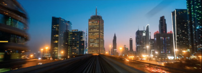 a train traveling through a city at night