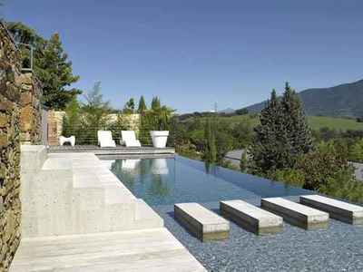 a swimming pool with steps leading up to it