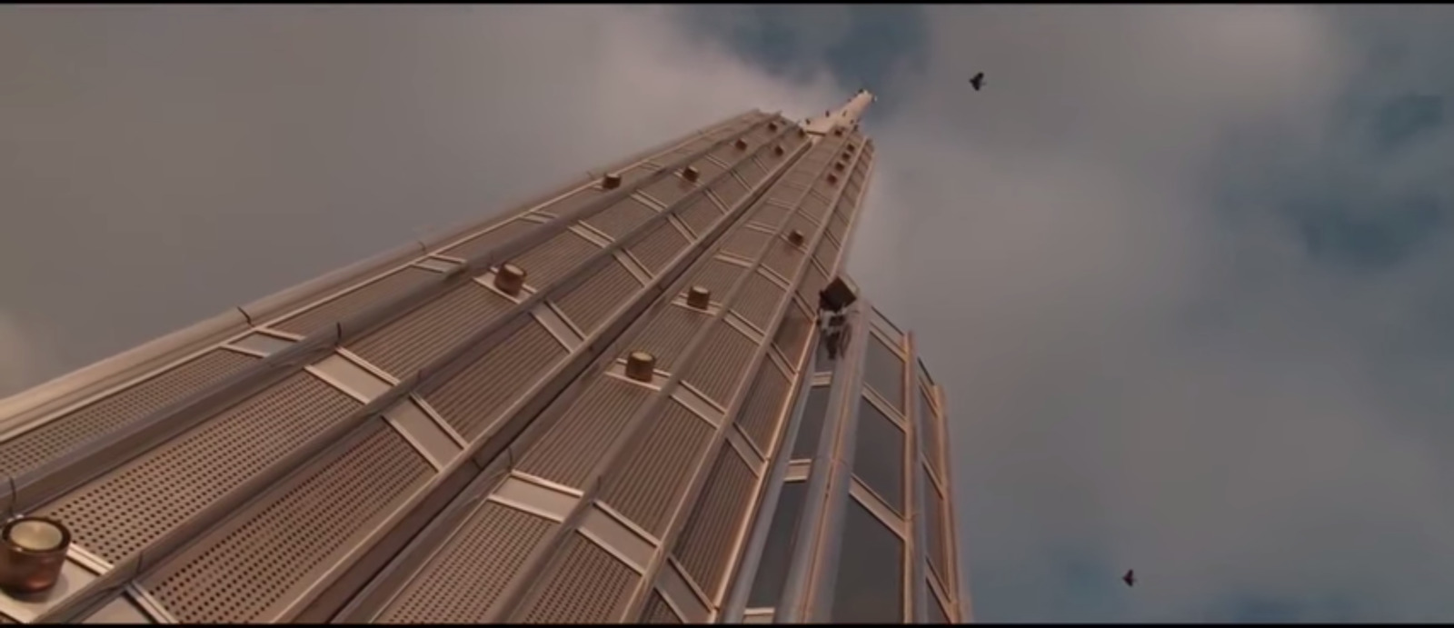 a very tall building with a sky background