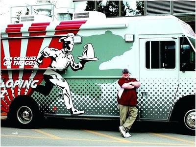 a man standing in front of a food truck