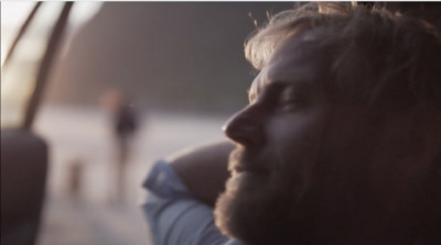 a man is looking out the window of a bus