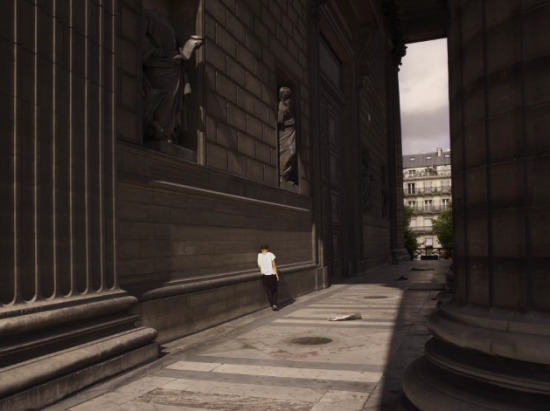 a person standing on the side of a building