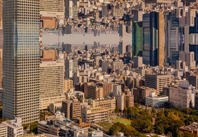 an aerial view of a city with tall buildings