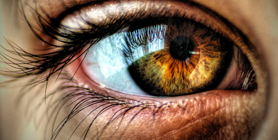 a close up of a person's blue eye