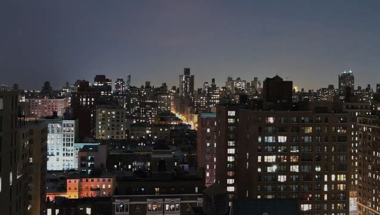 a view of a city at night from the top of a building