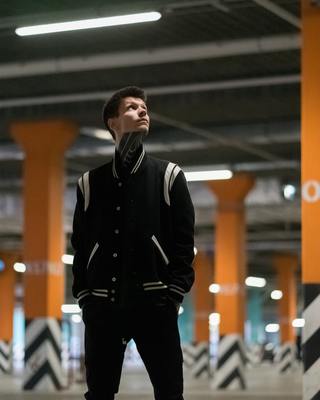 a man standing in a parking garage looking up