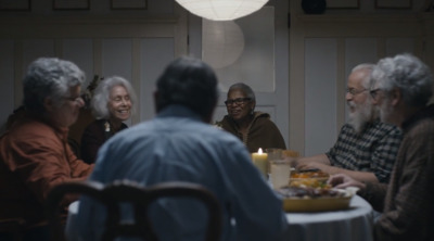 a group of people sitting around a dinner table