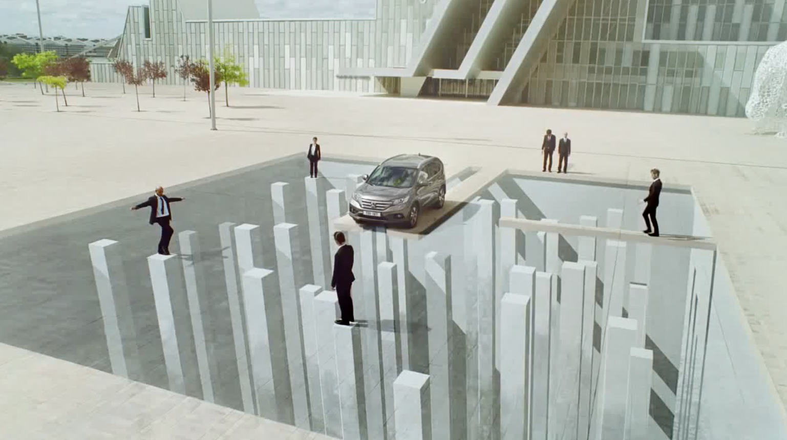 a group of people standing in front of a car