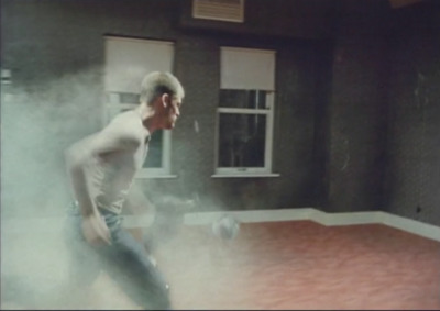 a man standing in a room with smoke coming out of it