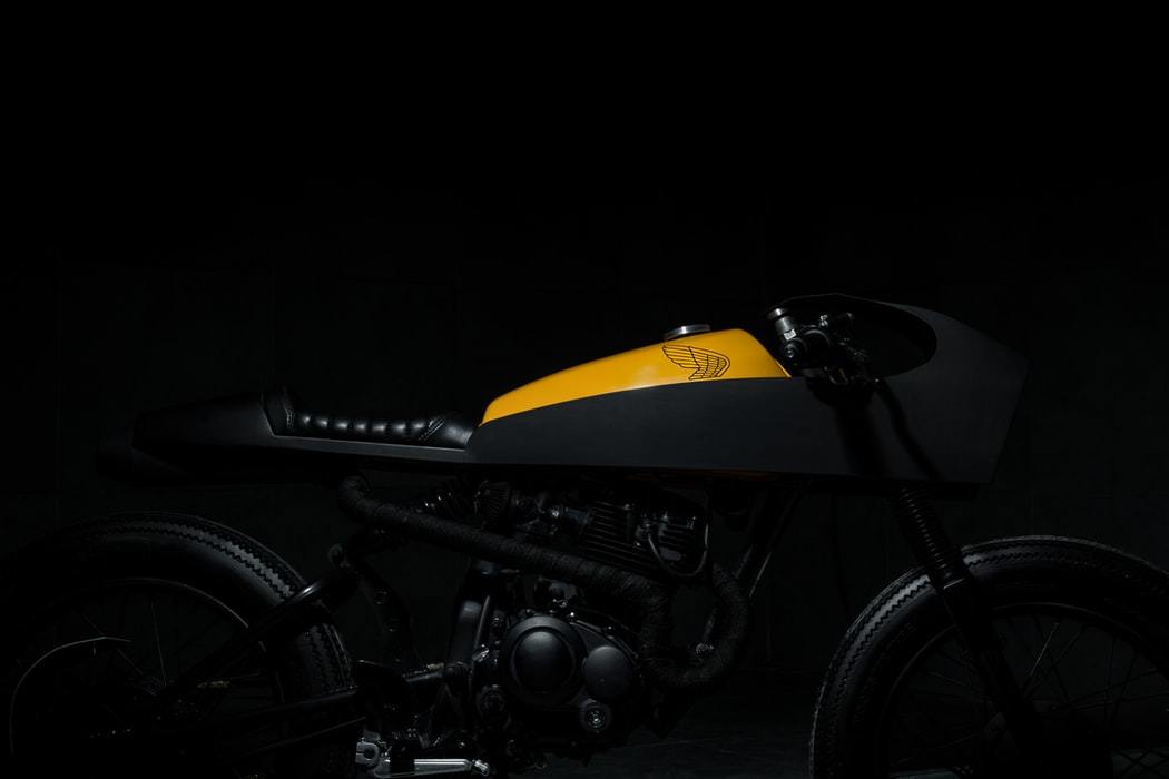 a black and yellow motorcycle in the dark