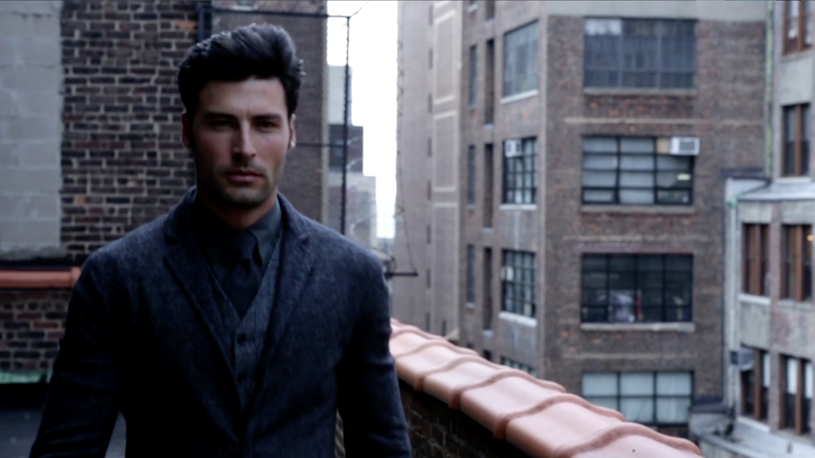 a man standing on a roof in a city