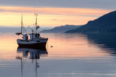 a boat floating on top of a large body of water