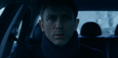 a man sitting in a car looking at the camera