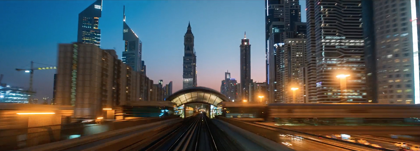 a train traveling through a city at night