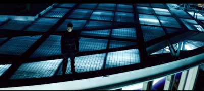 a man standing on top of a metal structure