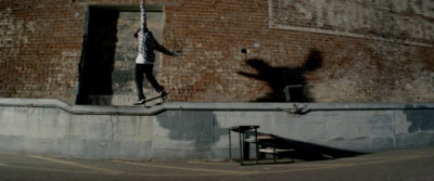 a man riding a skateboard up the side of a building