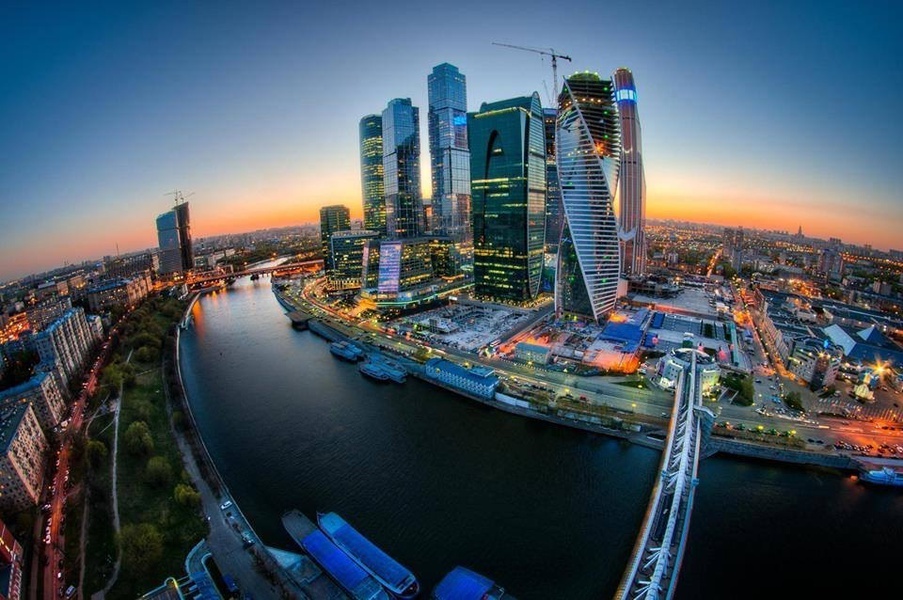 an aerial view of a city at dusk