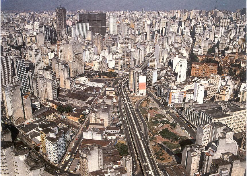 an aerial view of a city with high rise buildings