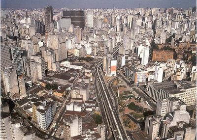 an aerial view of a city with high rise buildings