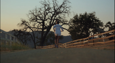 a person standing on a road with a skateboard