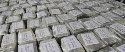 a large amount of silver bars with writing on them