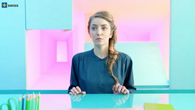 a woman sitting at a table with scissors in front of her