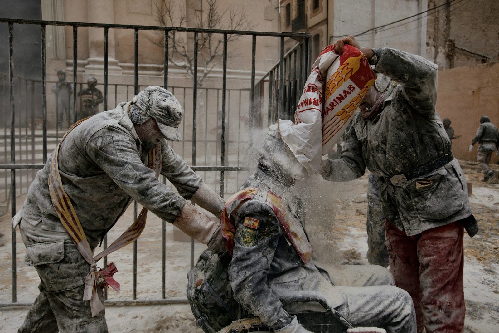 a group of men in military fatigues working on something