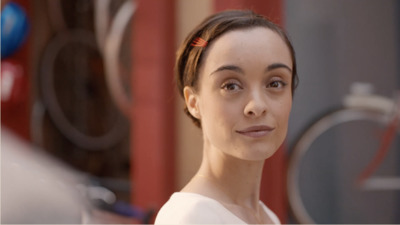 a woman with a red comb in her hair