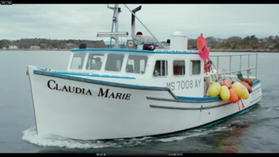 a large white boat with balloons on the front of it