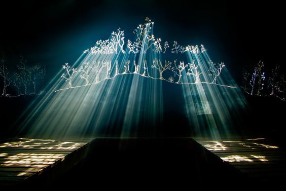 a group of people standing on top of a stage