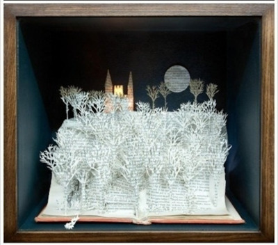 an open book with paper cut out of it