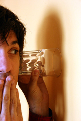 a man holding a glass of water to his face