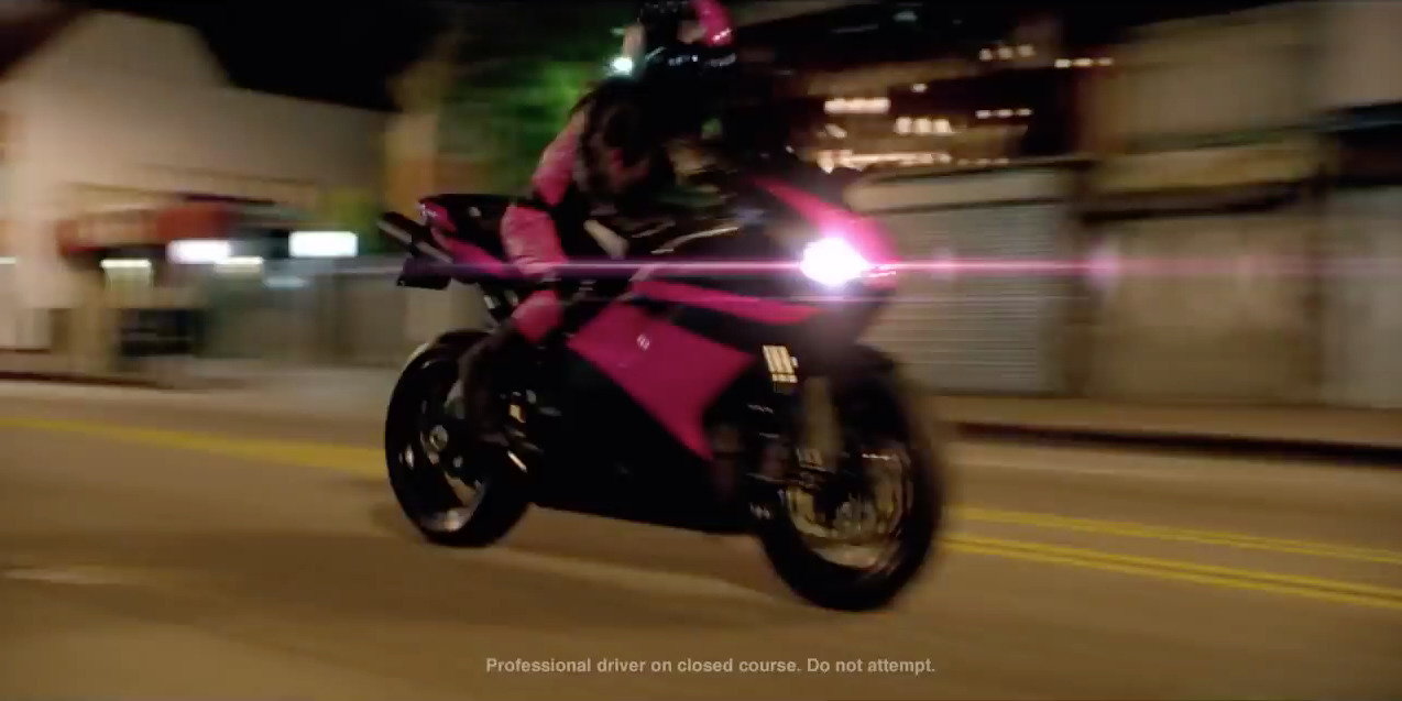 a person riding a motorcycle on a city street