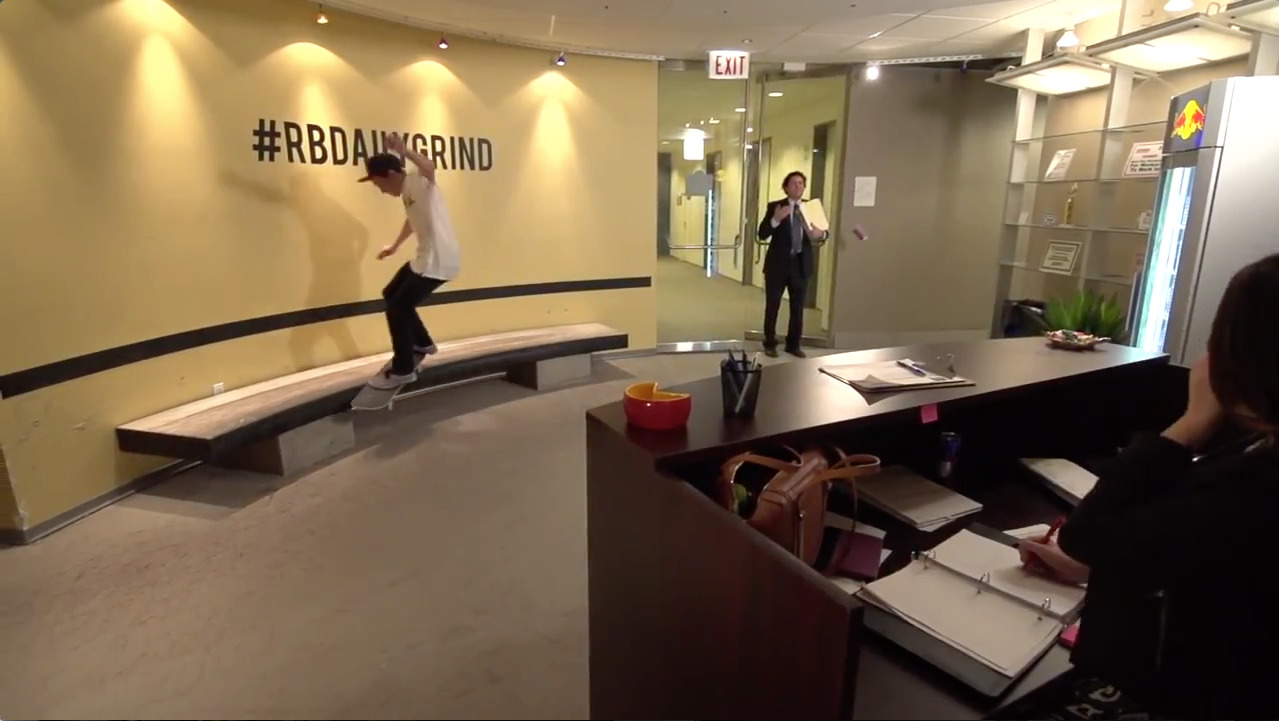 a man riding a skateboard across a wooden bench