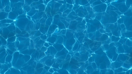 a swimming pool with blue water and ripples