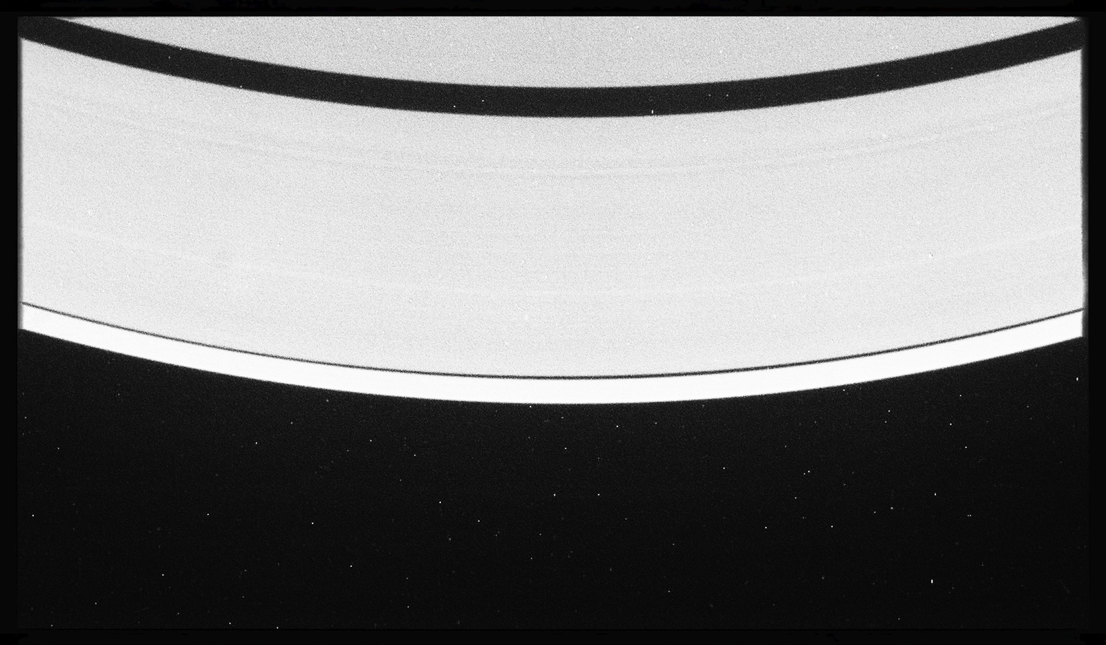 a black and white photo of saturn taken from space