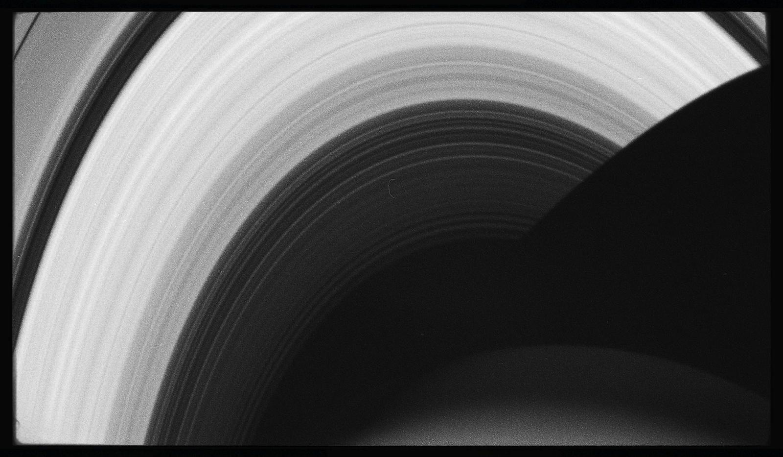 a black and white photo of saturn's rings