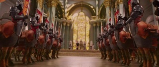 a group of men in armor standing in front of a cathedral